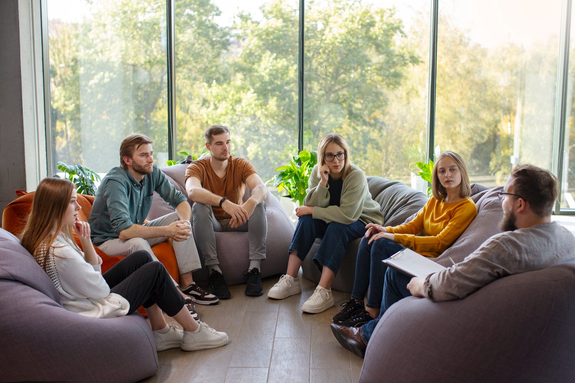 Young adults participating in a group therapy counseling session at Cook Counseling & Consulting in Columbus, Ohio.